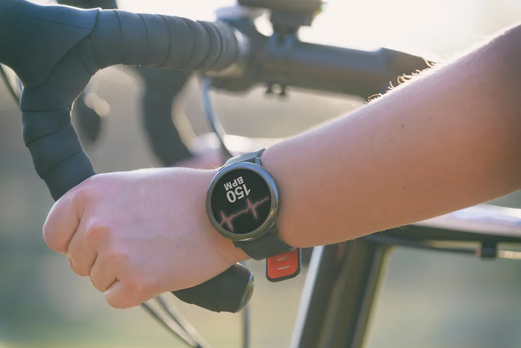 Female Exerciser Tracks ECG with a Smartwatch While Cycling